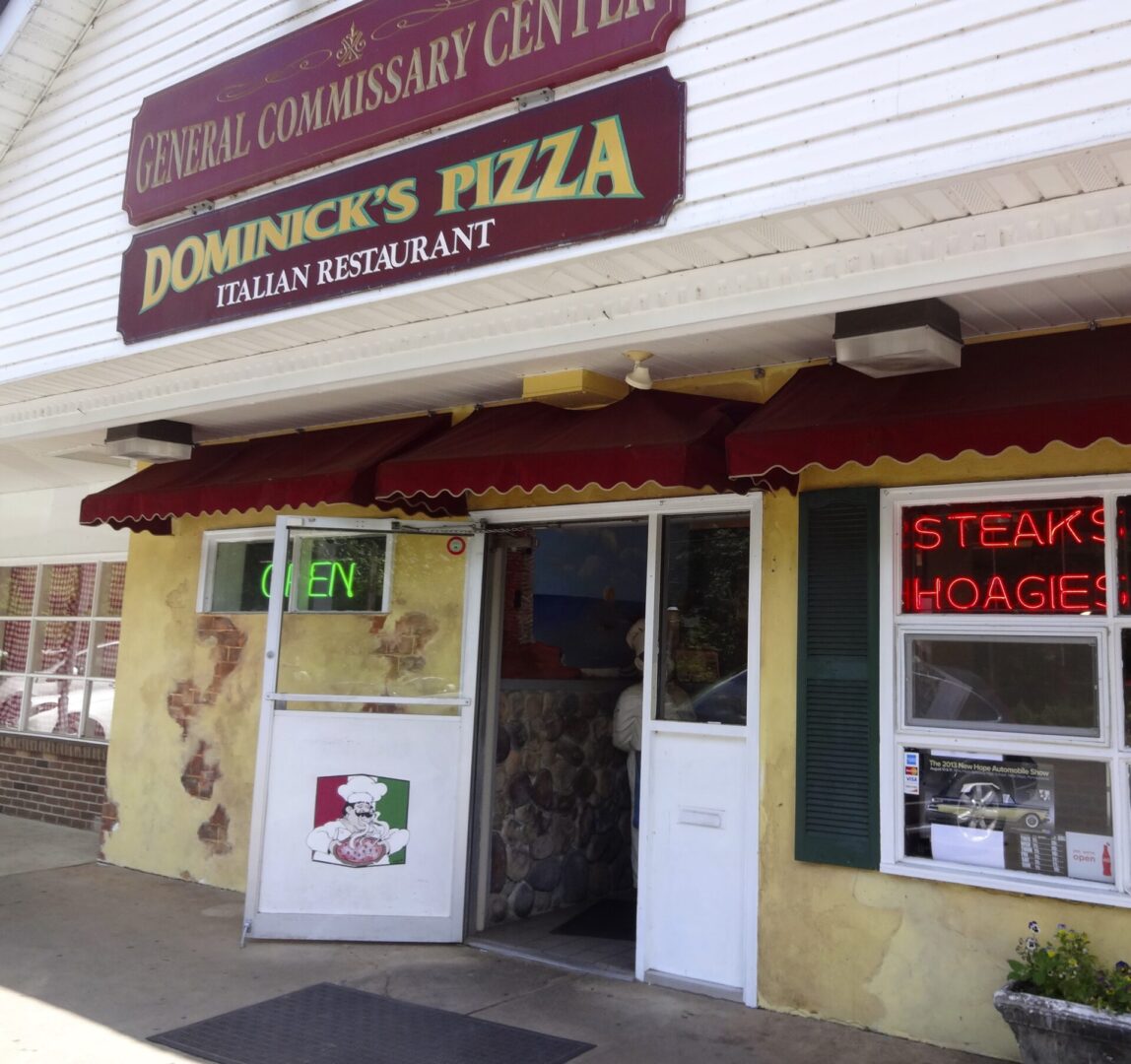 A pizza restaurant with a sign that says dominick 's pizza.