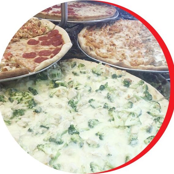 A group of pizzas sitting on top of pans.